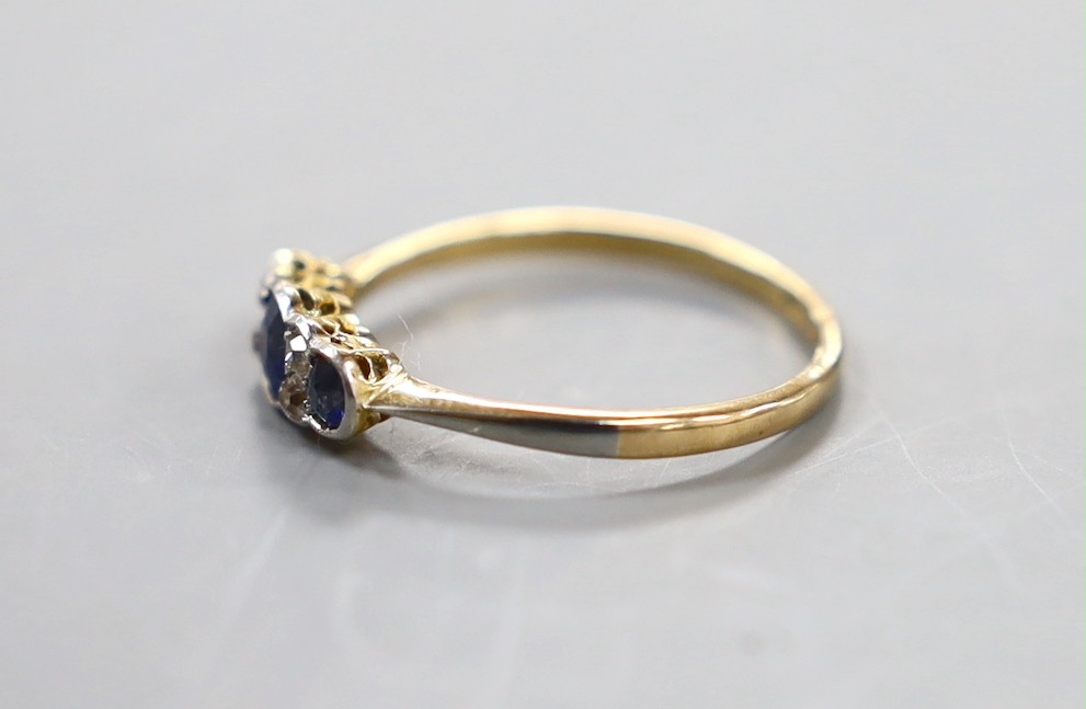 A 1920's 18ct and plat, three stone sapphire and four stone diamond chip set ring, size O, gross weight 1.9 grams.
